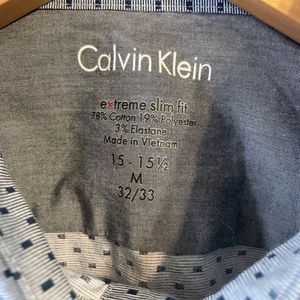 Size 15 - 15 1/2 32/33 Light blue with navy blue rectangle pattern.